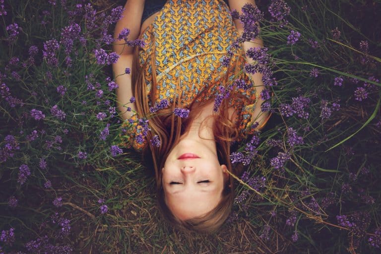 Woman sleeping in field of lavender