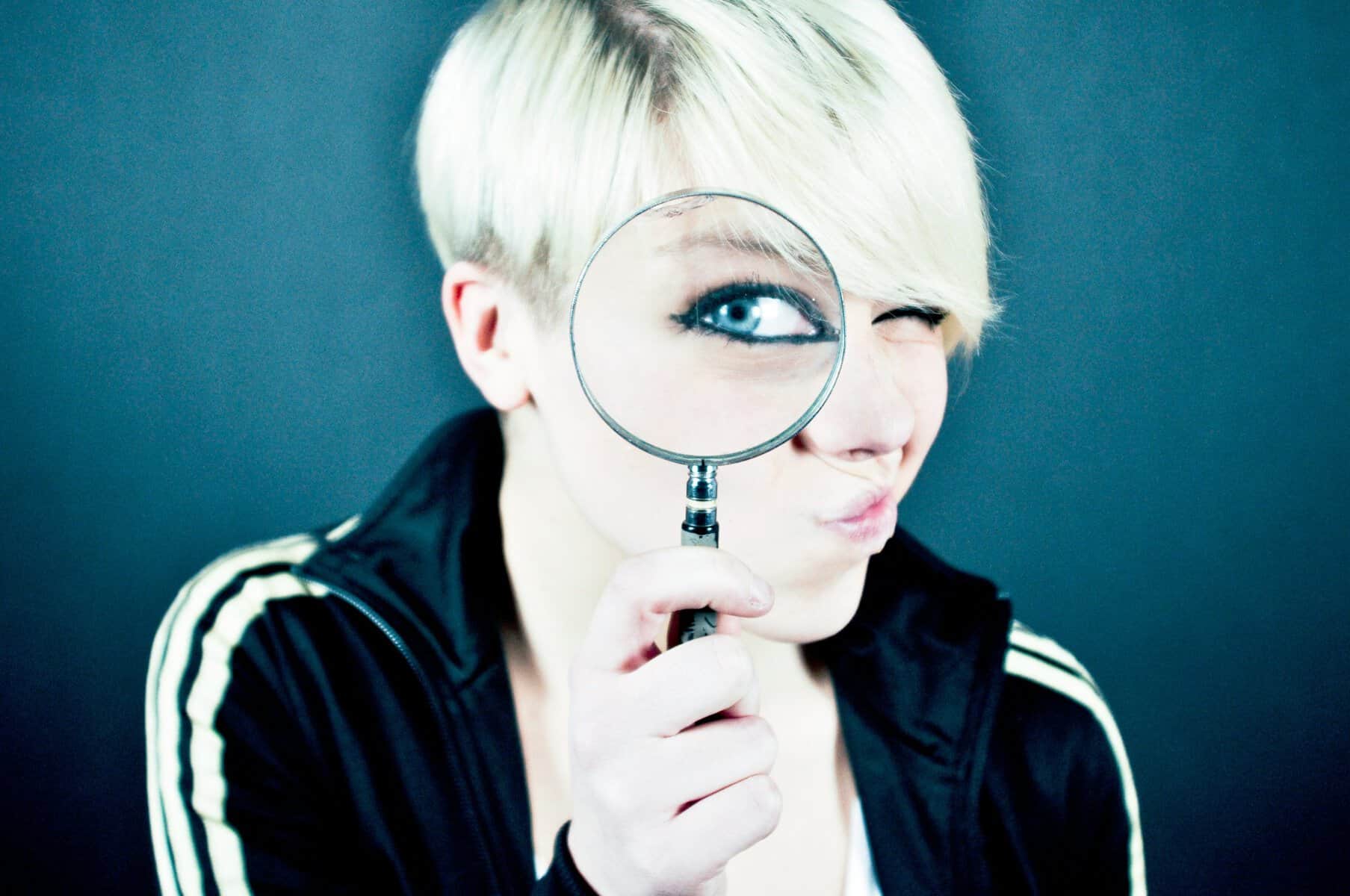 Woman with magnifying glass