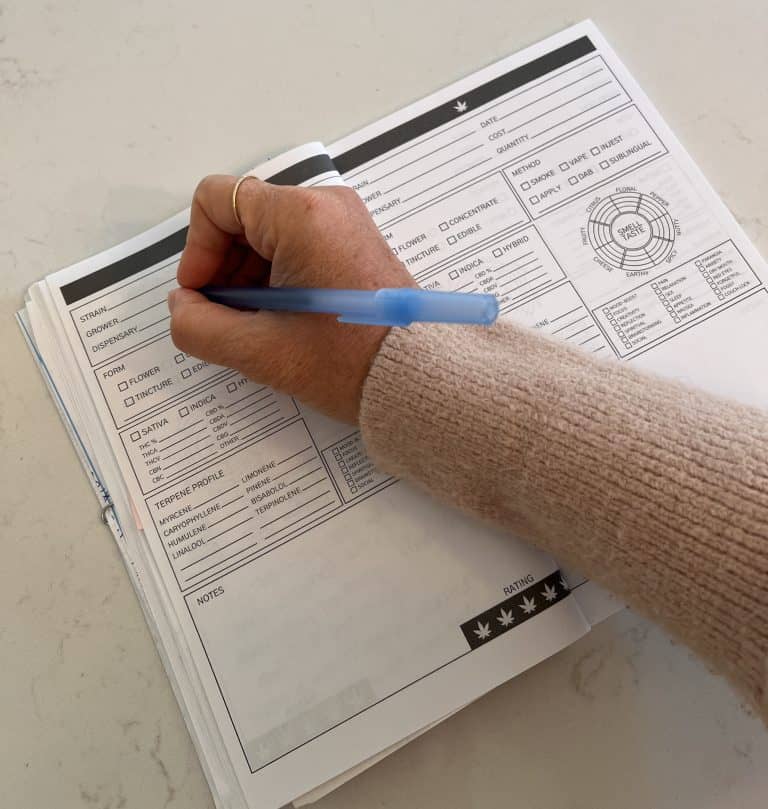 Kate Lily making an entry in a cannabis strain journal