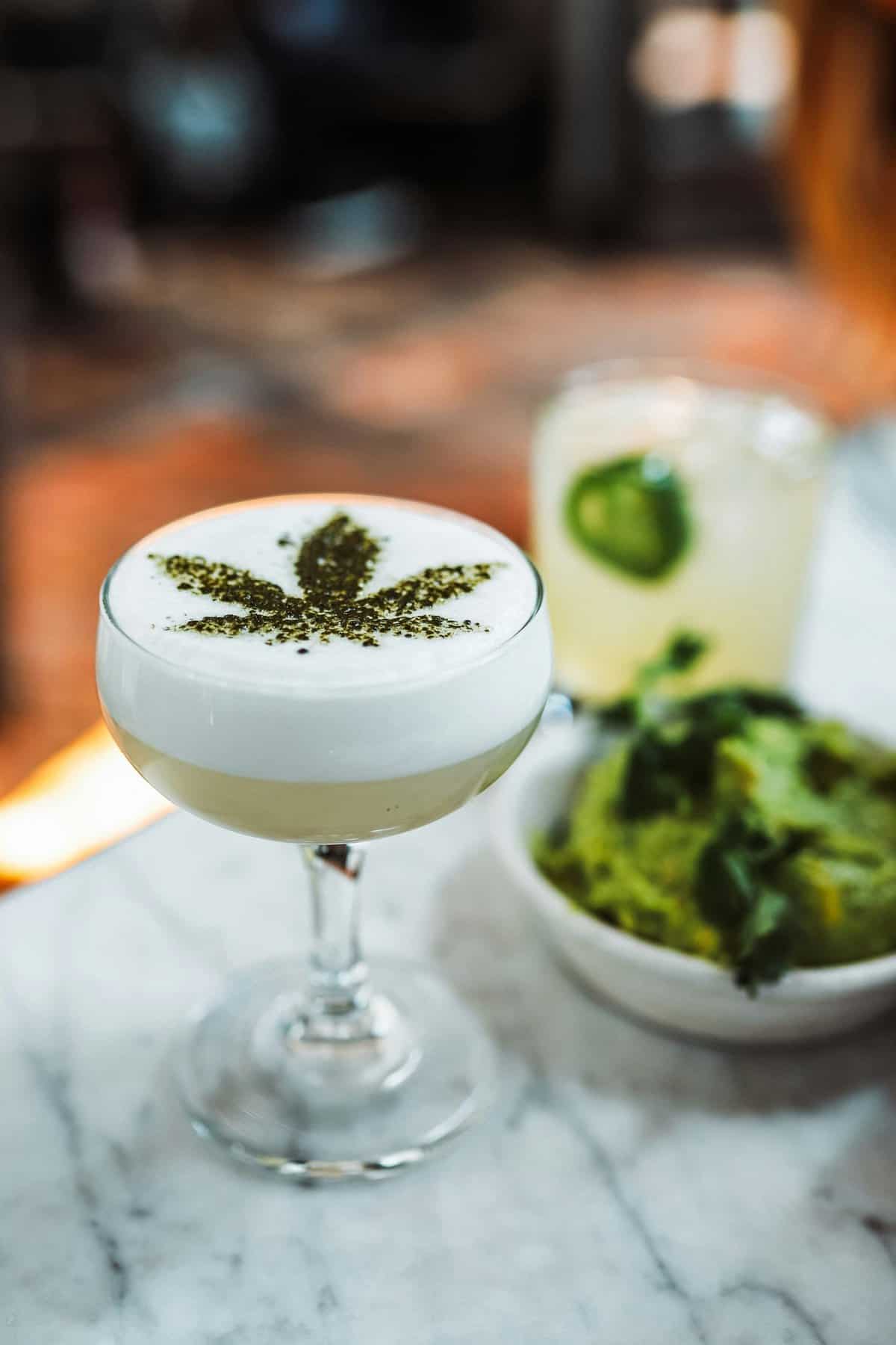 Fancy drink glass with cannabis leaf